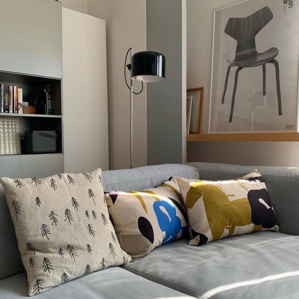 Mid-century modern inspired adjustable floor lamp with articulated design in stylish interior setting