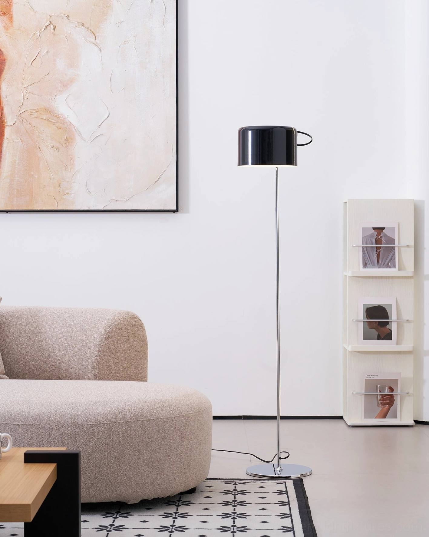Modern articulated floor lamp providing task lighting in home workspace or study area