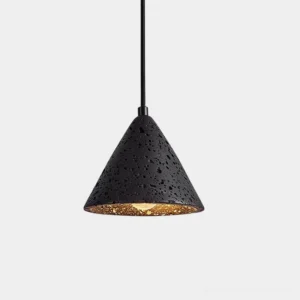 Cratera conical volcanic travertine pendant light with matte black porous finish and gold interior, studio front view