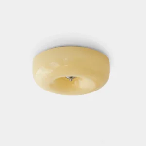 Cream donut ceiling light with glossy finish and chrome center fixture, bottom view on white background