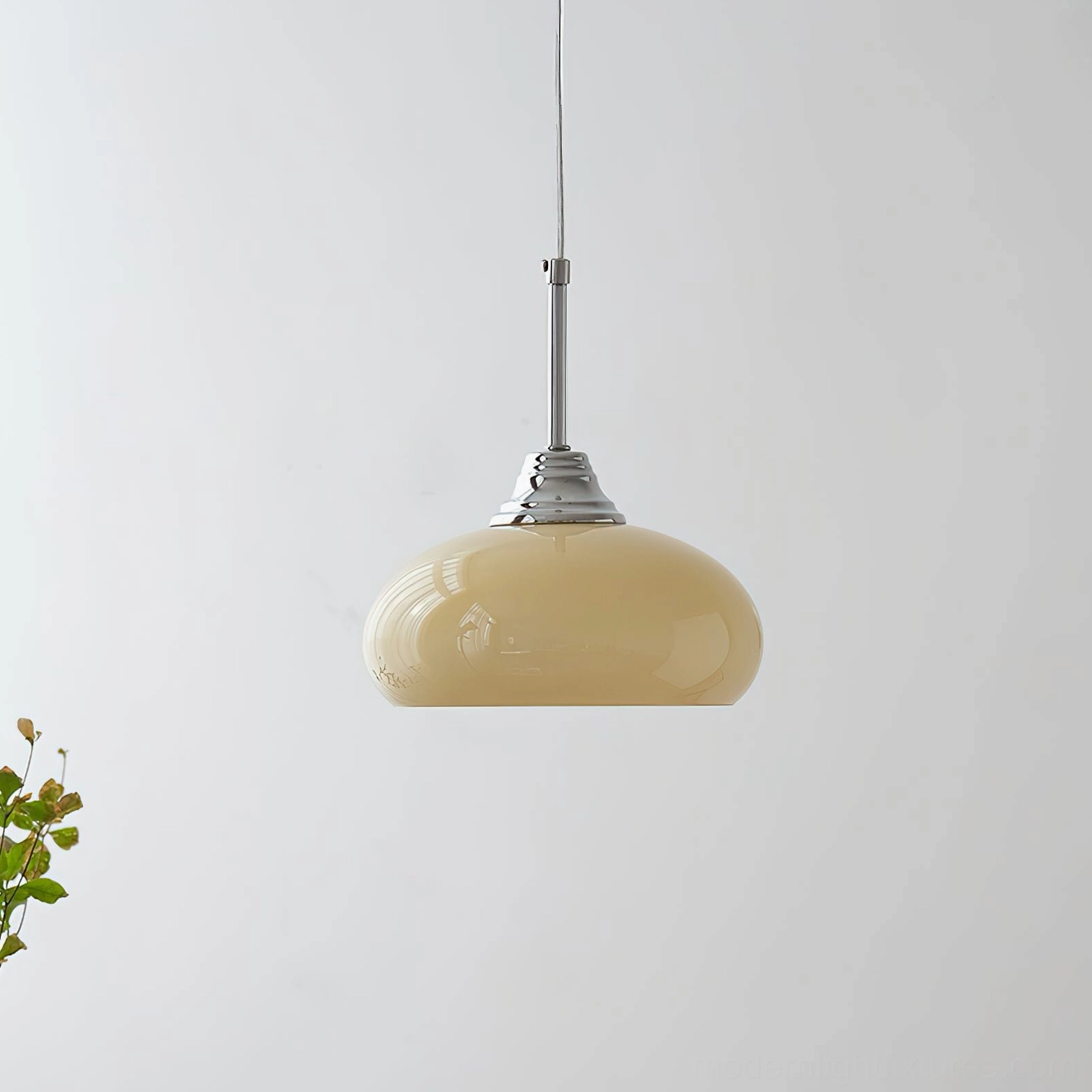 Modern vanilla pendant light with cream rounded glass shade in minimalist style, low angle shot