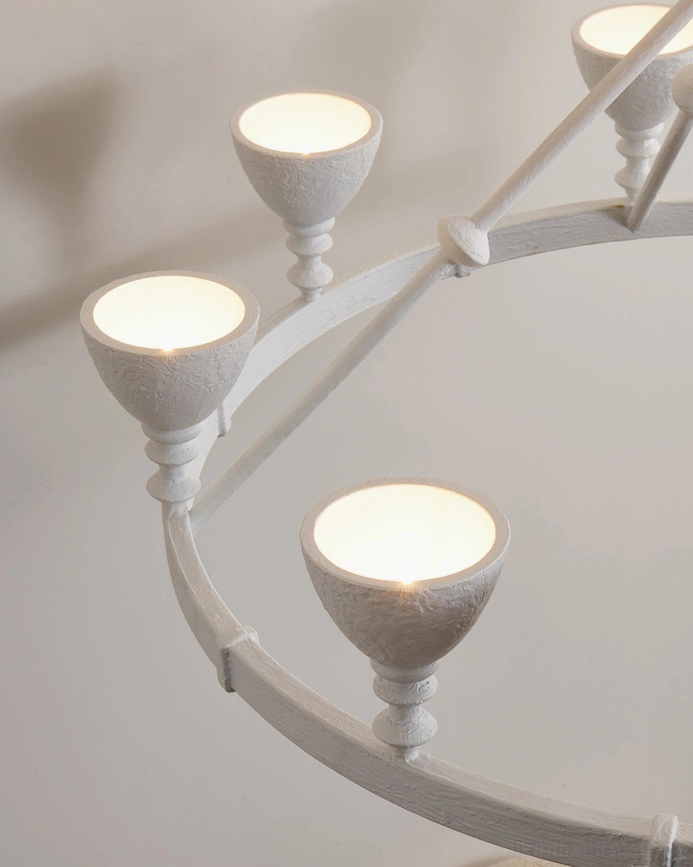 Cremora plaster brass ring chandelier matte finish showcasing artisanal weathered surface quality