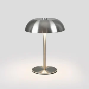 Illuminated Crescent LED table lamp emitting warm ambient light, showcasing three-color changing capability
