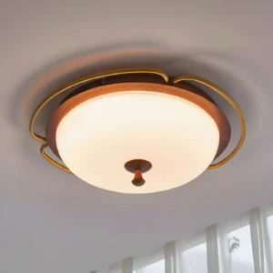 Crescent Orbit flush mount ceiling lamp installed overhead showing gold crescent detail and warm illumination