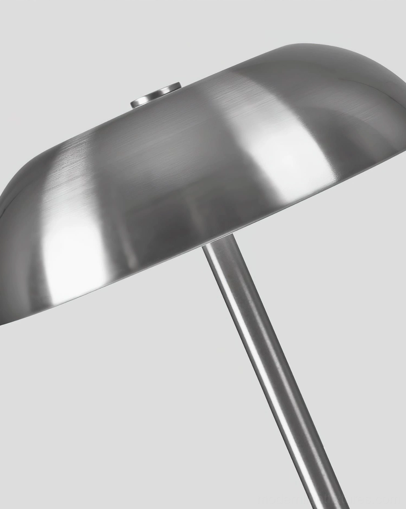 Close-up detail of Crescent table lamp brushed metallic texture and hardware construction