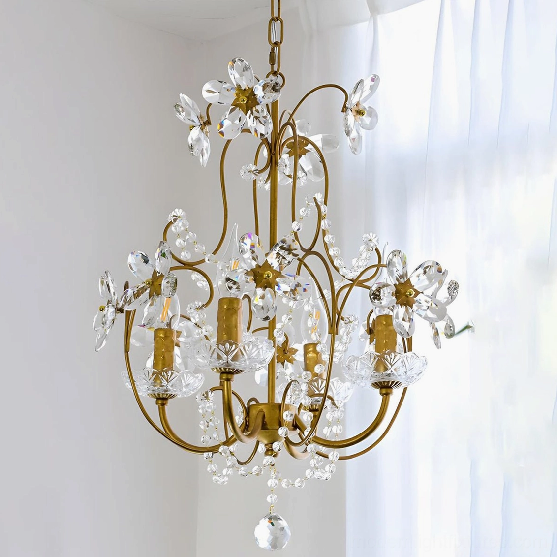 Close-up view of Cristavelle crystal flower chandelier with polished brass frame and clear crystal petals