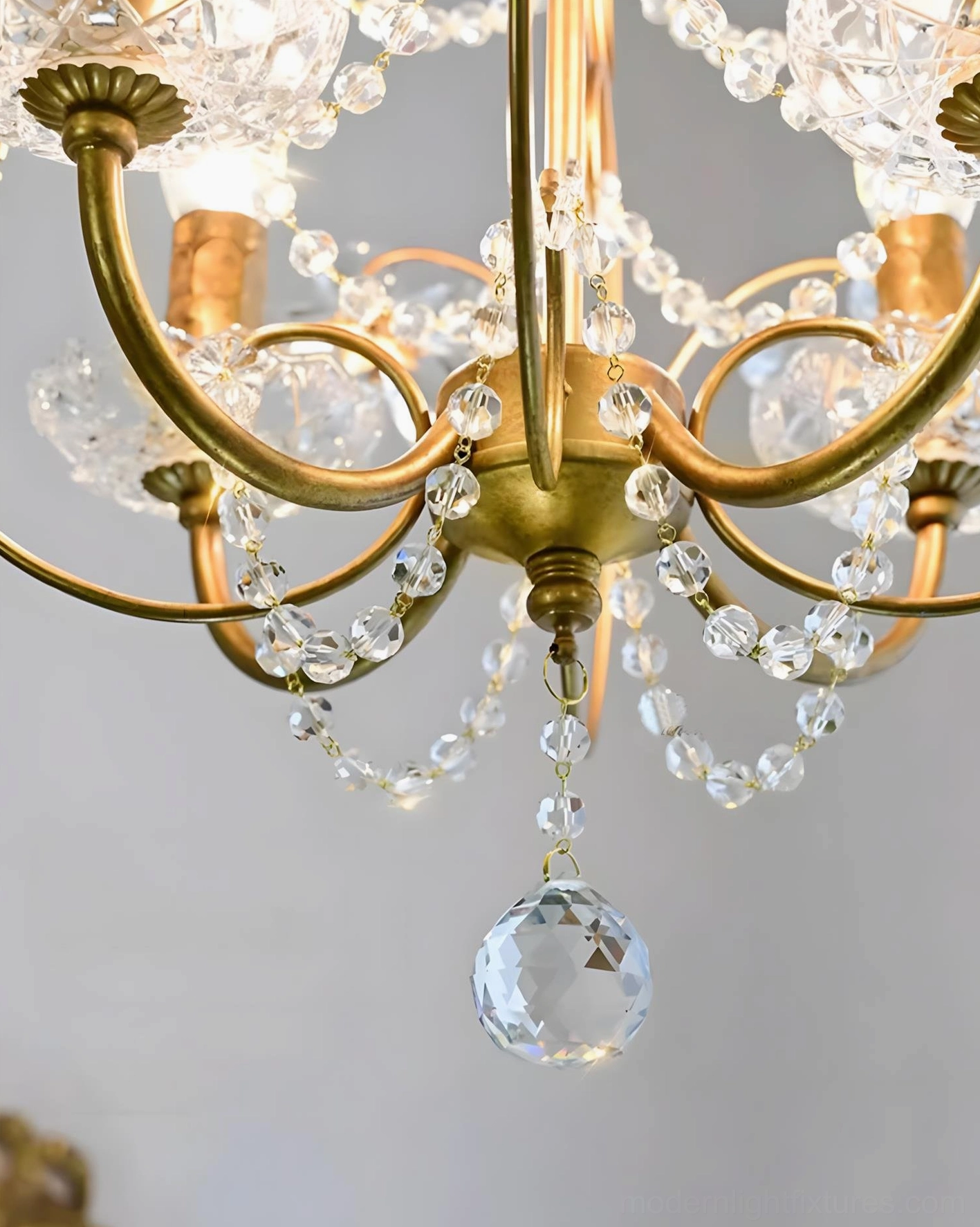 Vintage-style crystal pendant chandelier with polished copper finish and clear crystal components