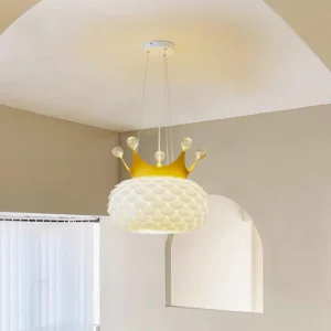 Modern crown pendant chandelier hanging in minimalist beige home interior with arched doorway