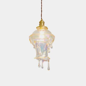 Crystal clear water drop pendant light with brass base shown on white background - modern resin hanging lamp design