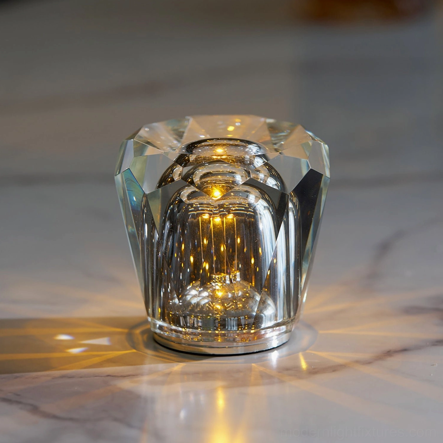 Hand-cut crystal diamond table lamp with polished facets on white marble surface, warm glow illuminating surrounding area with silver metal base