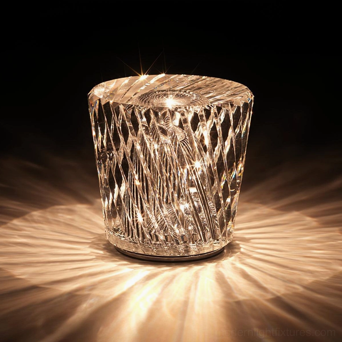Crystal diamond table lamp emitting warm 3000K light, eye-level view on dark backdrop showing prismatic refraction effect