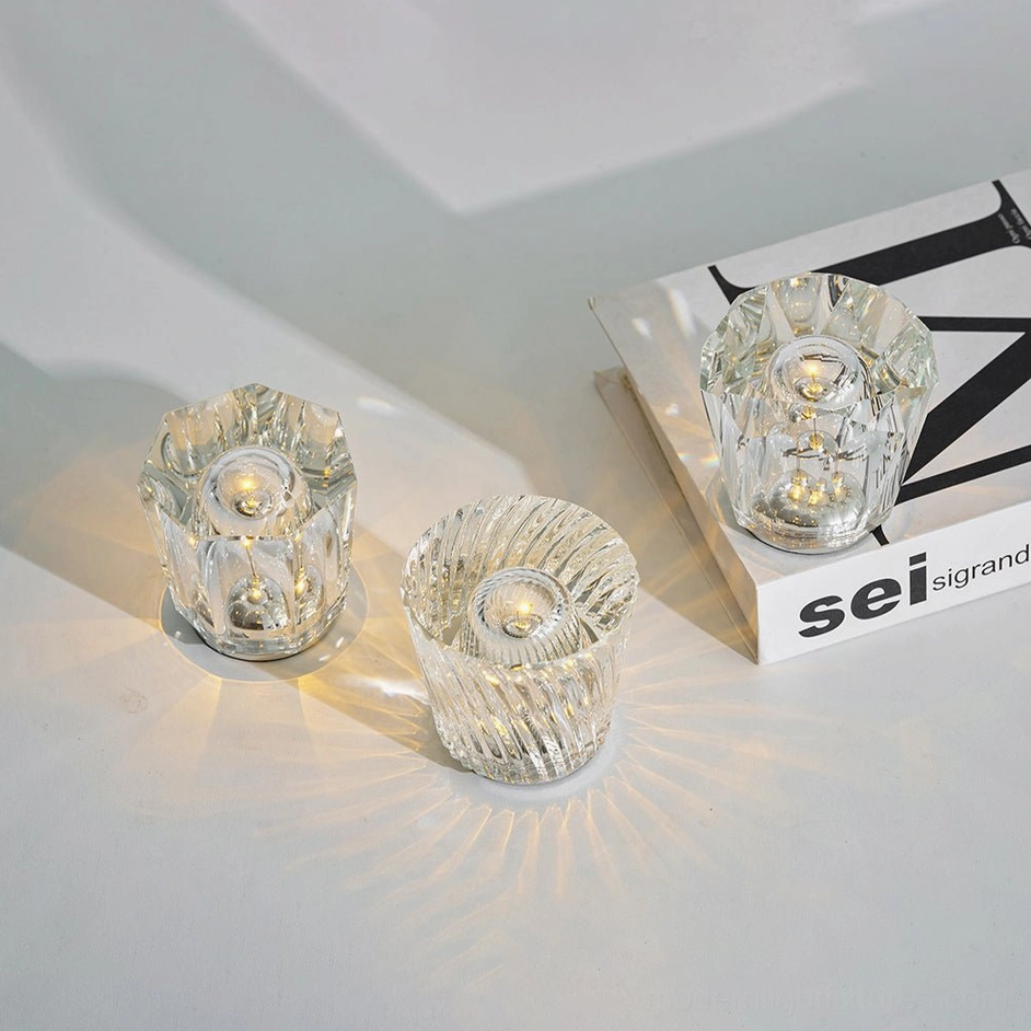 Crystal diamond lamp positioned on furniture surface, showcasing hand-cut crystal glass brightness and polished metal base