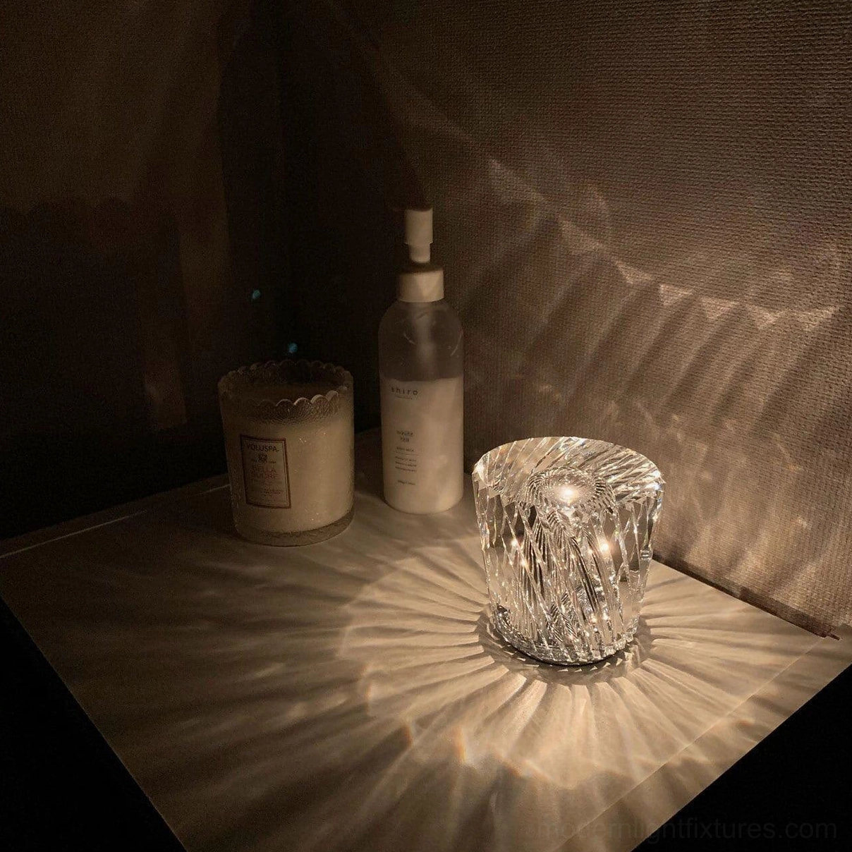 Crystal diamond table lamp with integrated USB charging port at base, cordless battery operation, warm 3000K light source