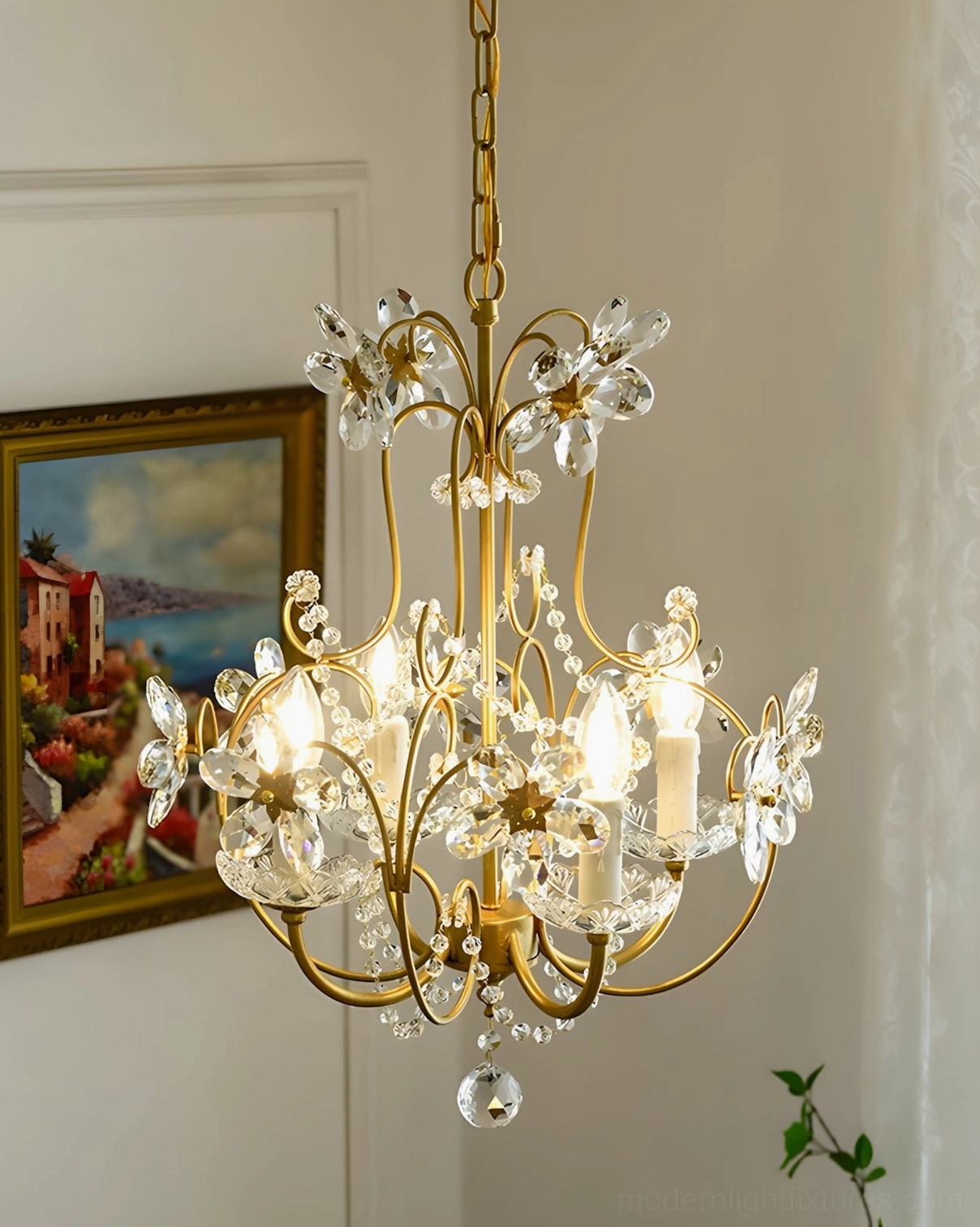 Crystal flower pendant light with gracefully curved brass arms in sculptural arrangement