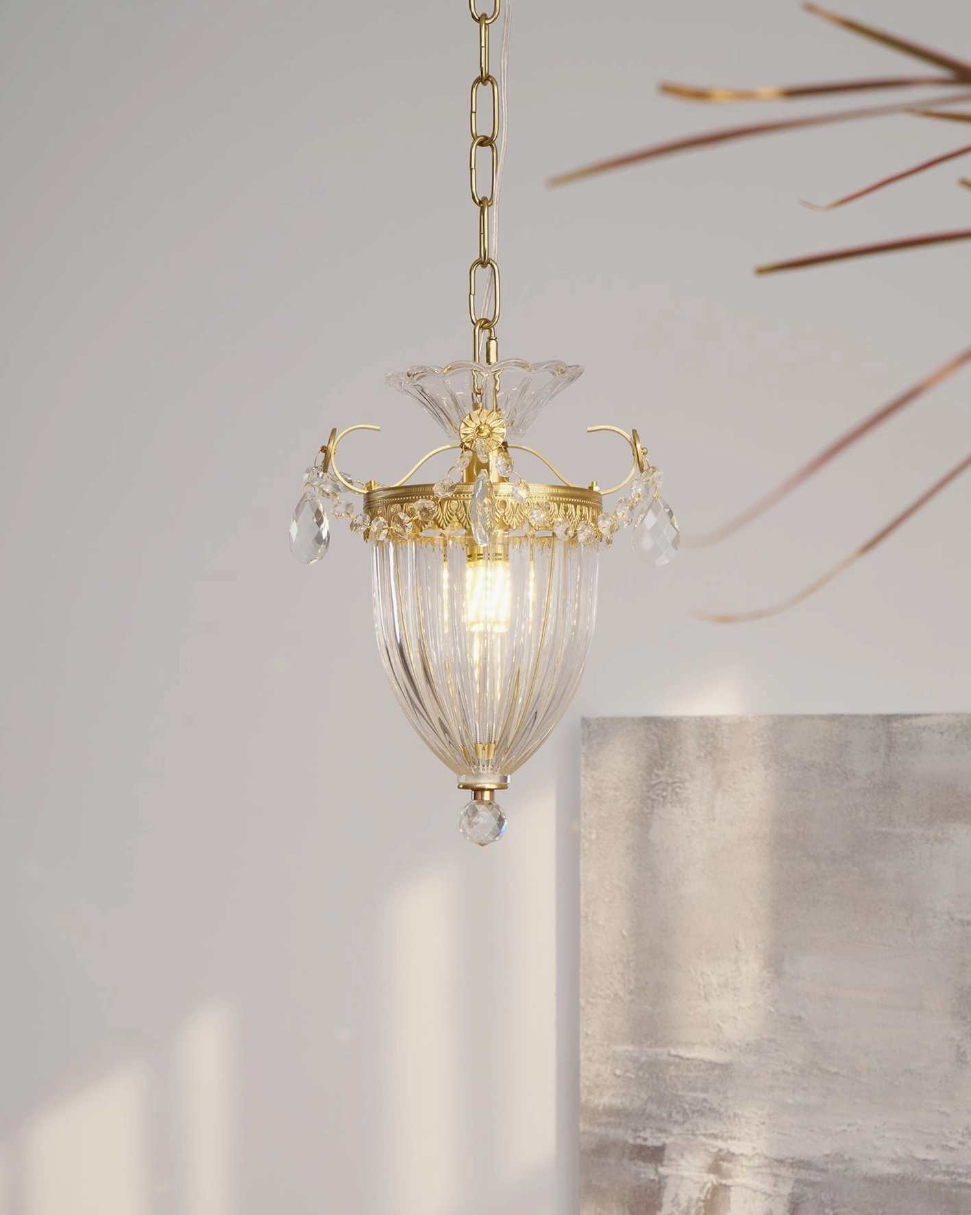 Crystal pendant light fixture highlighting prismatic glass refraction and decorative hanging crystals