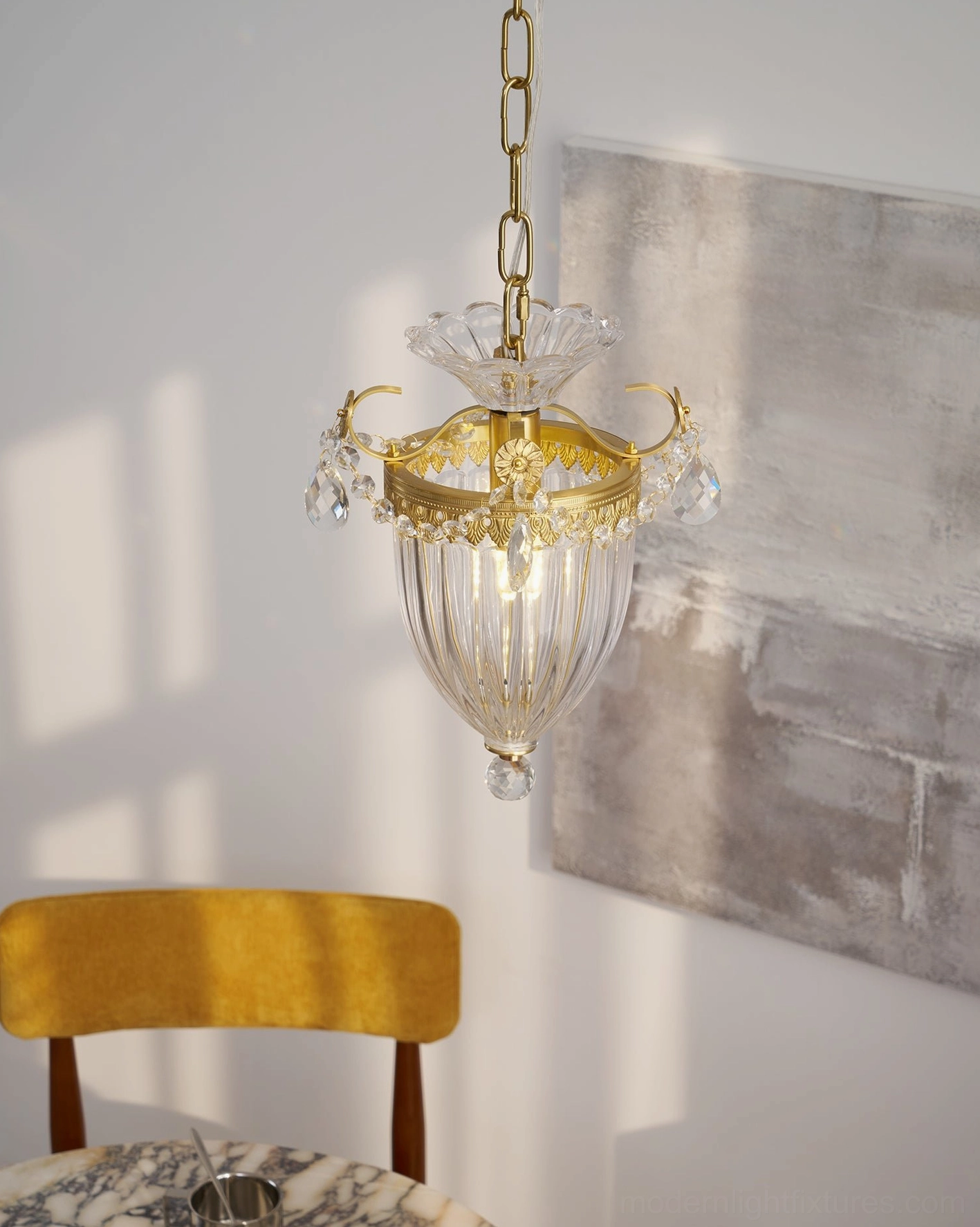 Vintage crystal pendant chandelier creating warm ambient lighting in contemporary bedroom interior
