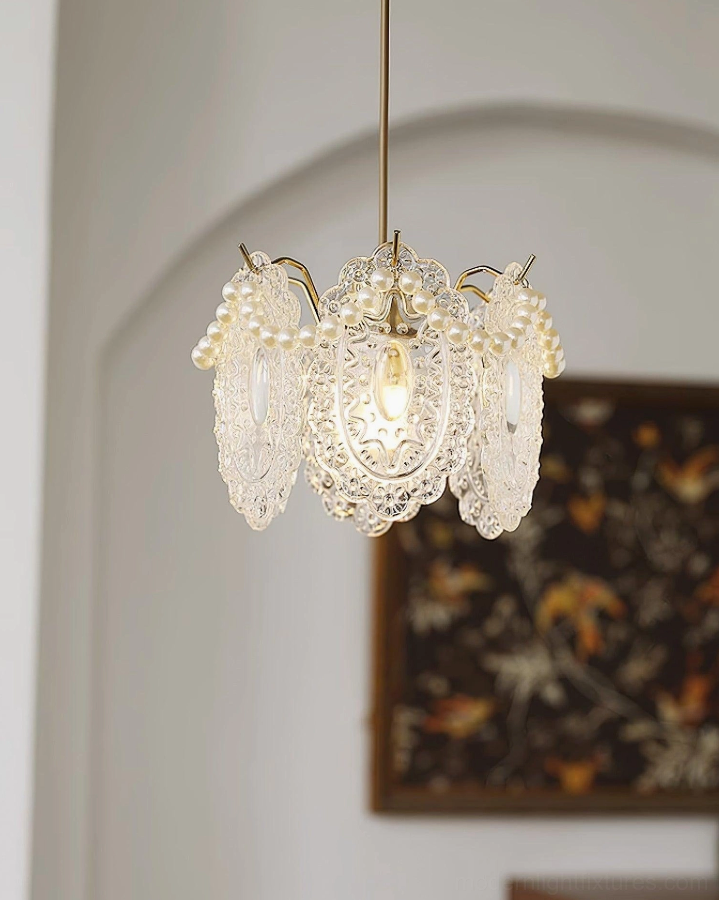 Crystal petal pendant light fixture showcasing intricate glass design and light refraction patterns in interior setting