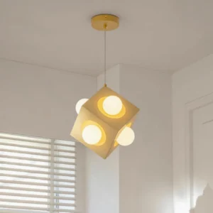 Contemporary cubic LED pendant lamp hanging in residential living room with warm ambient lighting and window blinds