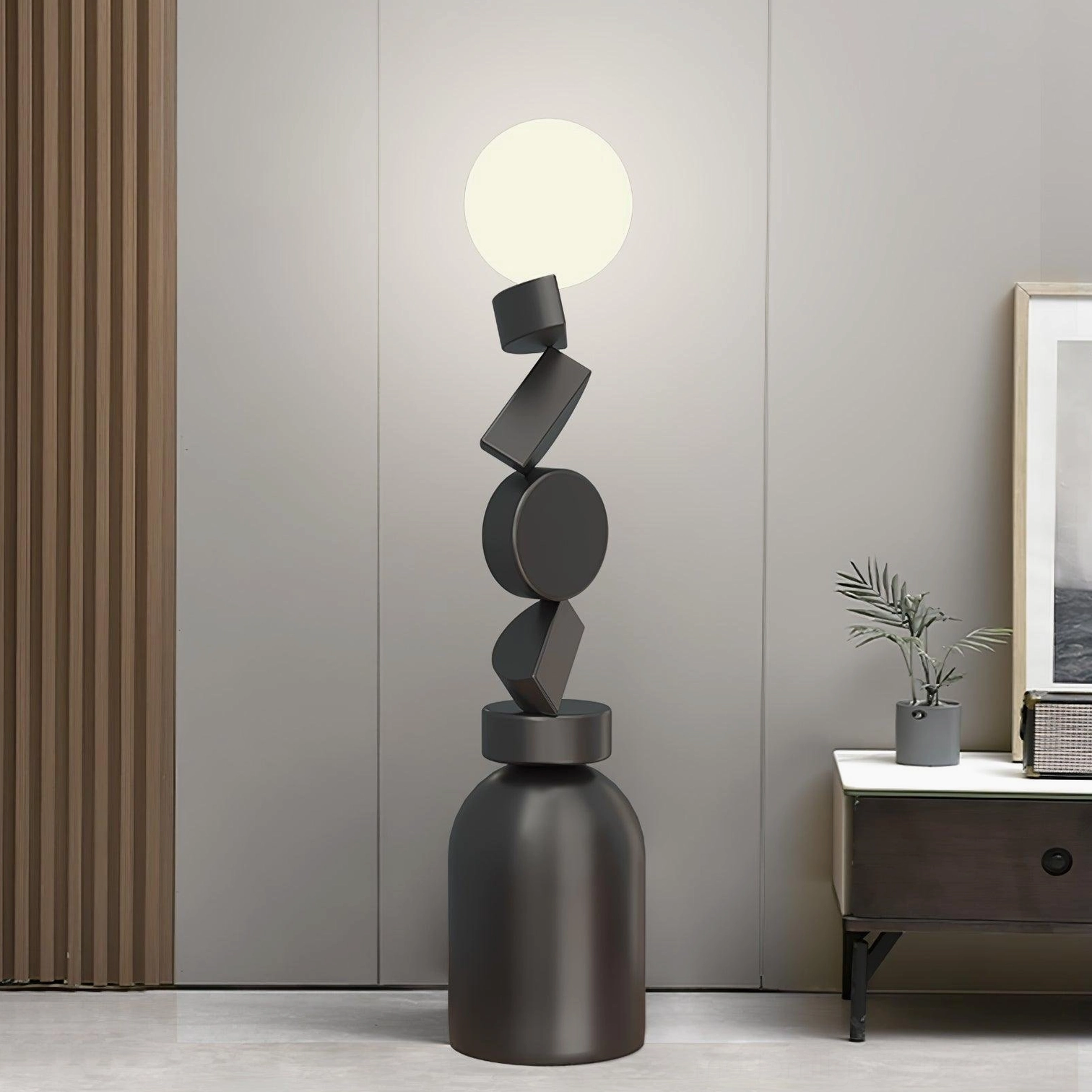 Cubu geometric stacked floor lamp with side table and wall art in modern living space