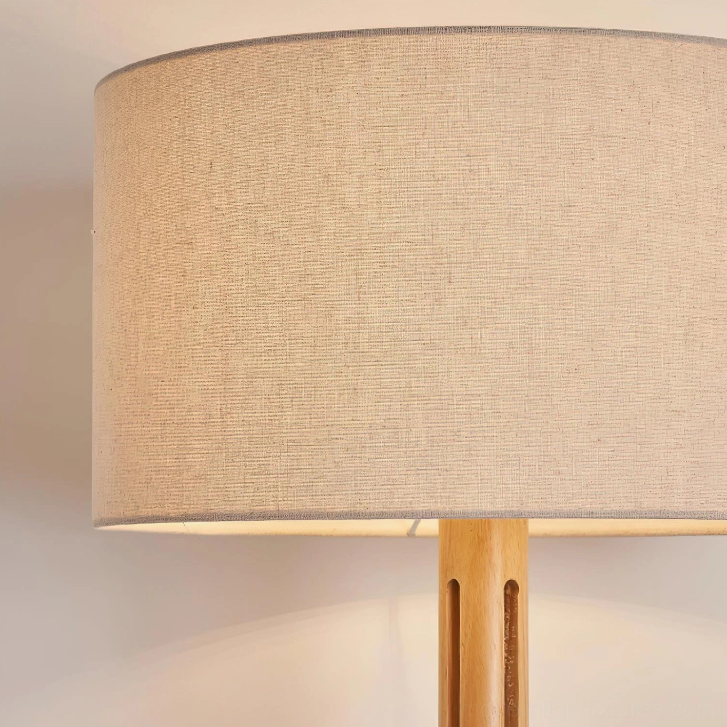Culver wood floor lamp linen shade close-up showing beige fabric texture and wooden pole base detail