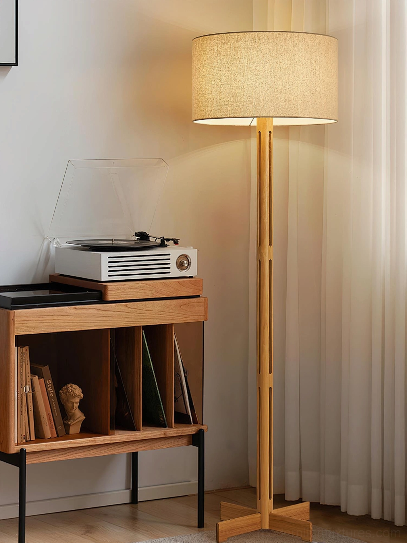 Culver floor lamp with warm lighting beside vinyl record shelf and wooden furniture in mid-century modern room