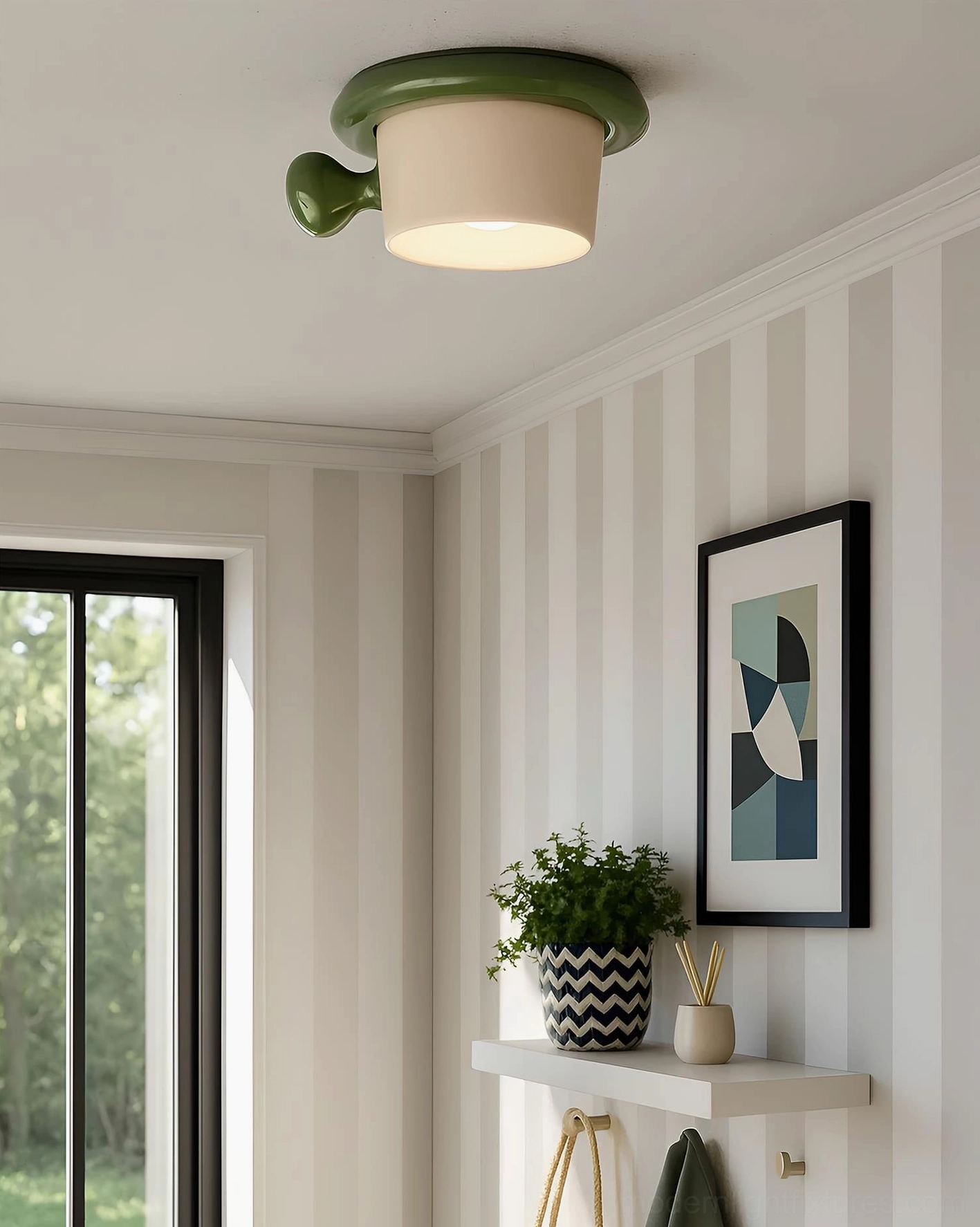 Green teacup ceiling light mounted in residential entryway with wall decor