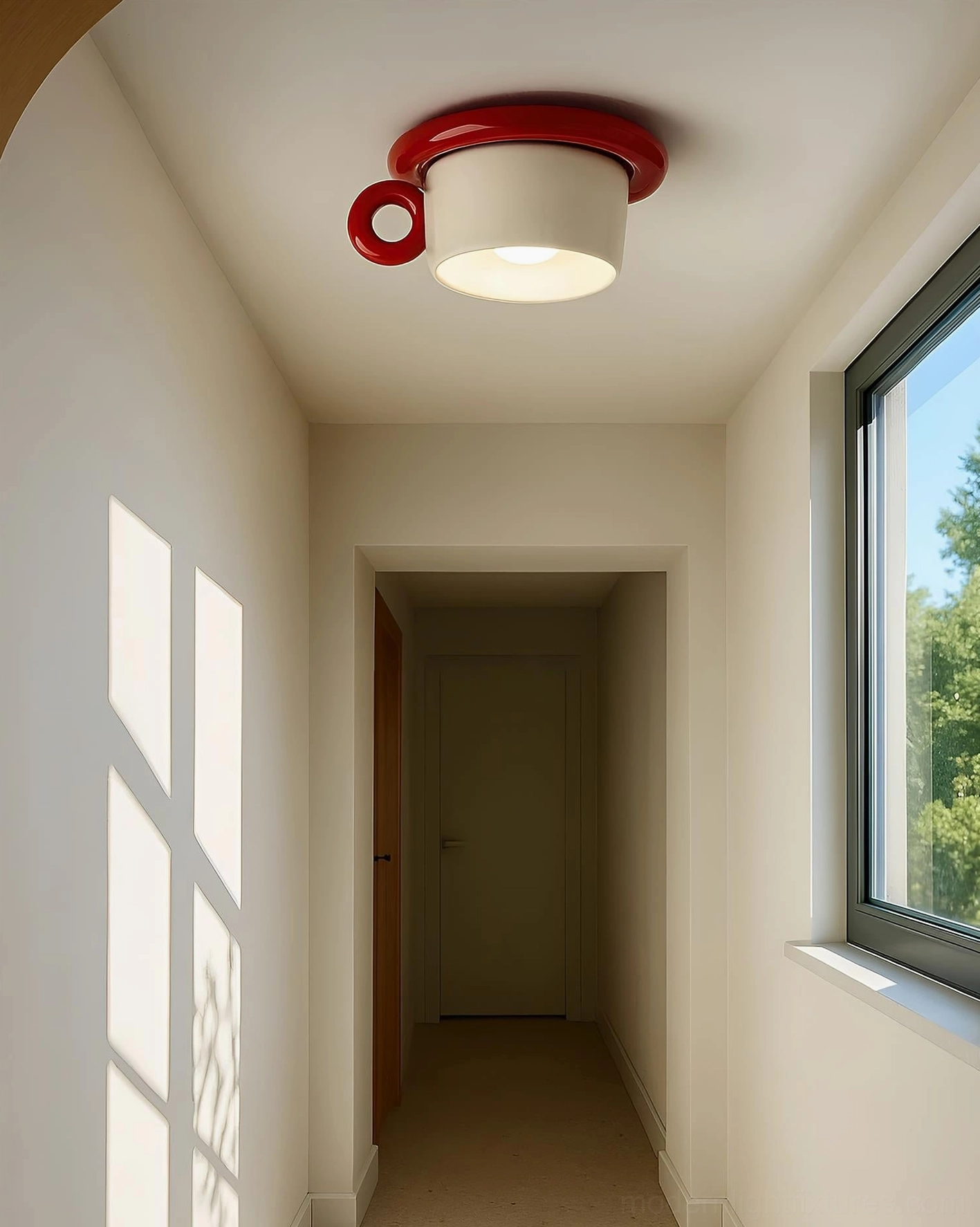 Red teacup-shaped ceiling light installed in residential hallway corridor interior
