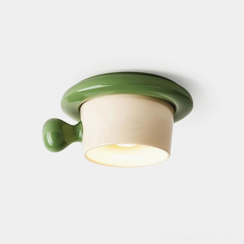 Cupola ceramic ceiling light fixture with green rim detail, front studio view on white background