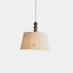 Handcrafted daisy embroidered pendant lamp with pleated beige fabric shade and wooden bead fixture, front studio view