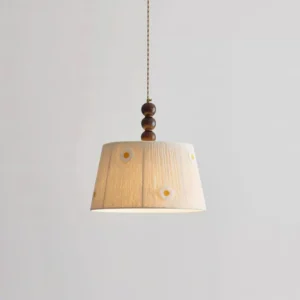 Vintage farmhouse daisy pendant light with hand-embroidered cotton shade and walnut wooden top mount, three-quarter angle