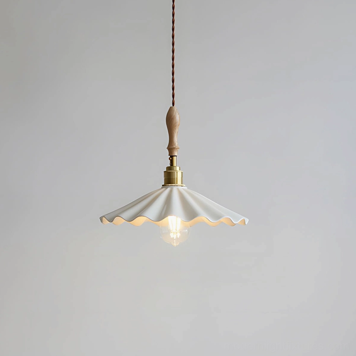 Front view of daisy ripple ceramic pendant showing scalloped edges and white matte finish
