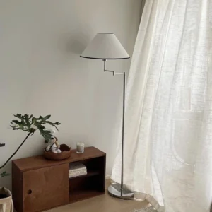 Dakota swing arm floor lamp in contemporary living room with wooden furniture and green plants Nordic style