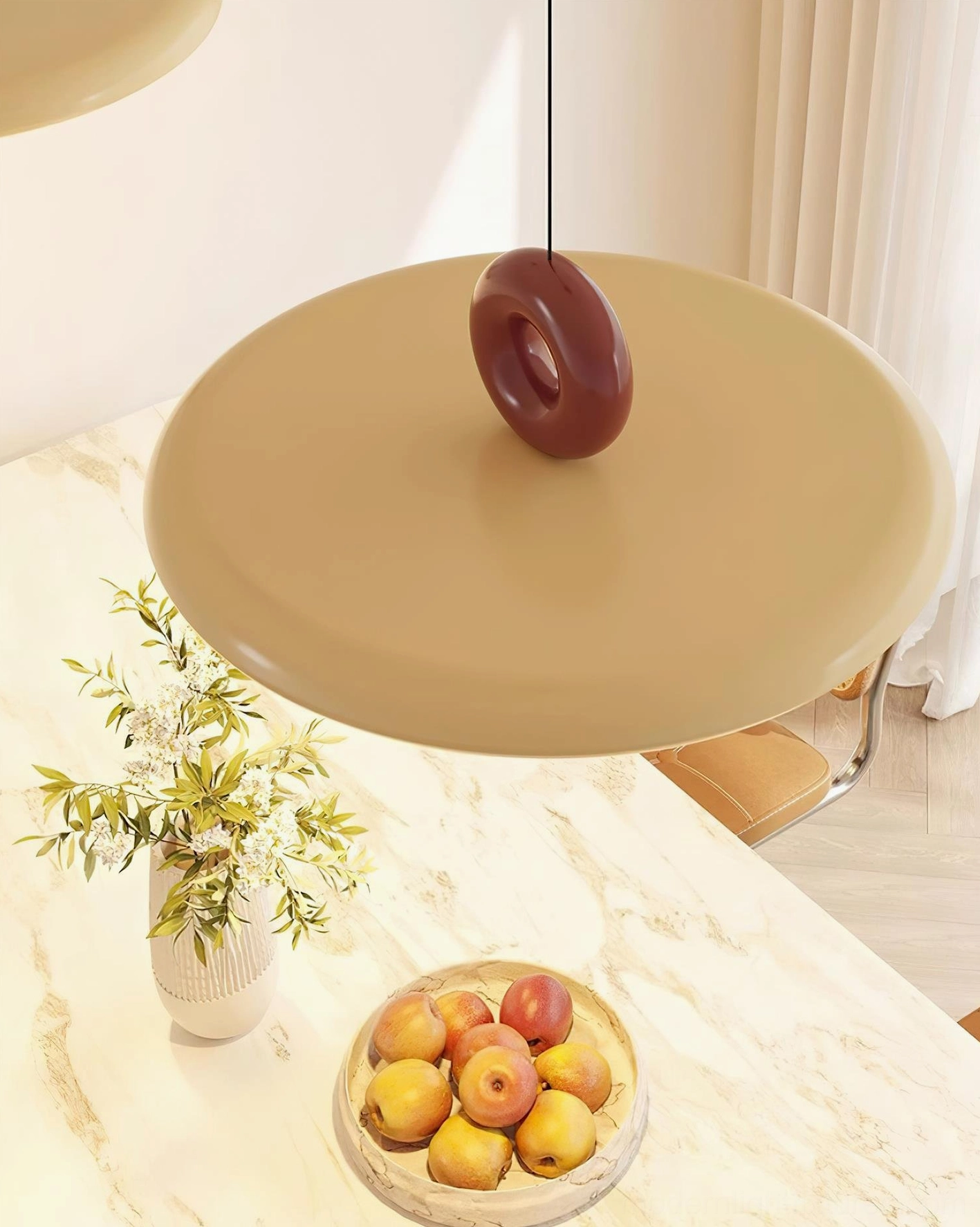 Dalia modern pendant light in beige with maroon accent, close-up view on marble kitchen surface