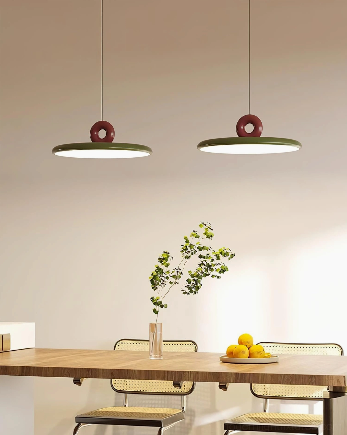 Dual Dalia pendant lights in matching green and burgundy, hanging in modern residential dining room