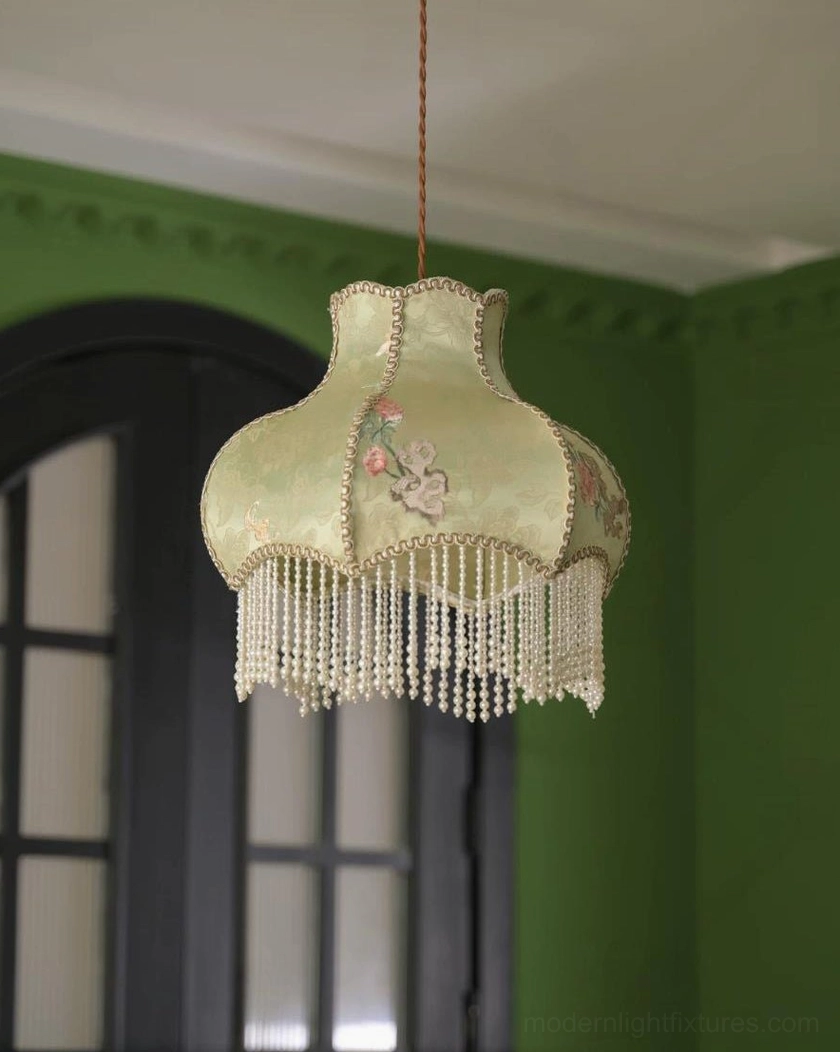 Hardwired vintage pendant light showing adjustable cord and ceiling canopy mounting hardware