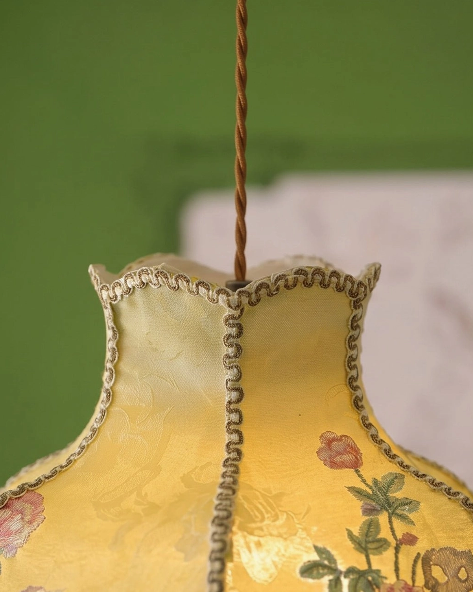 Beaded fringe pendant light detail showing cascading beads and scalloped hem edge treatment