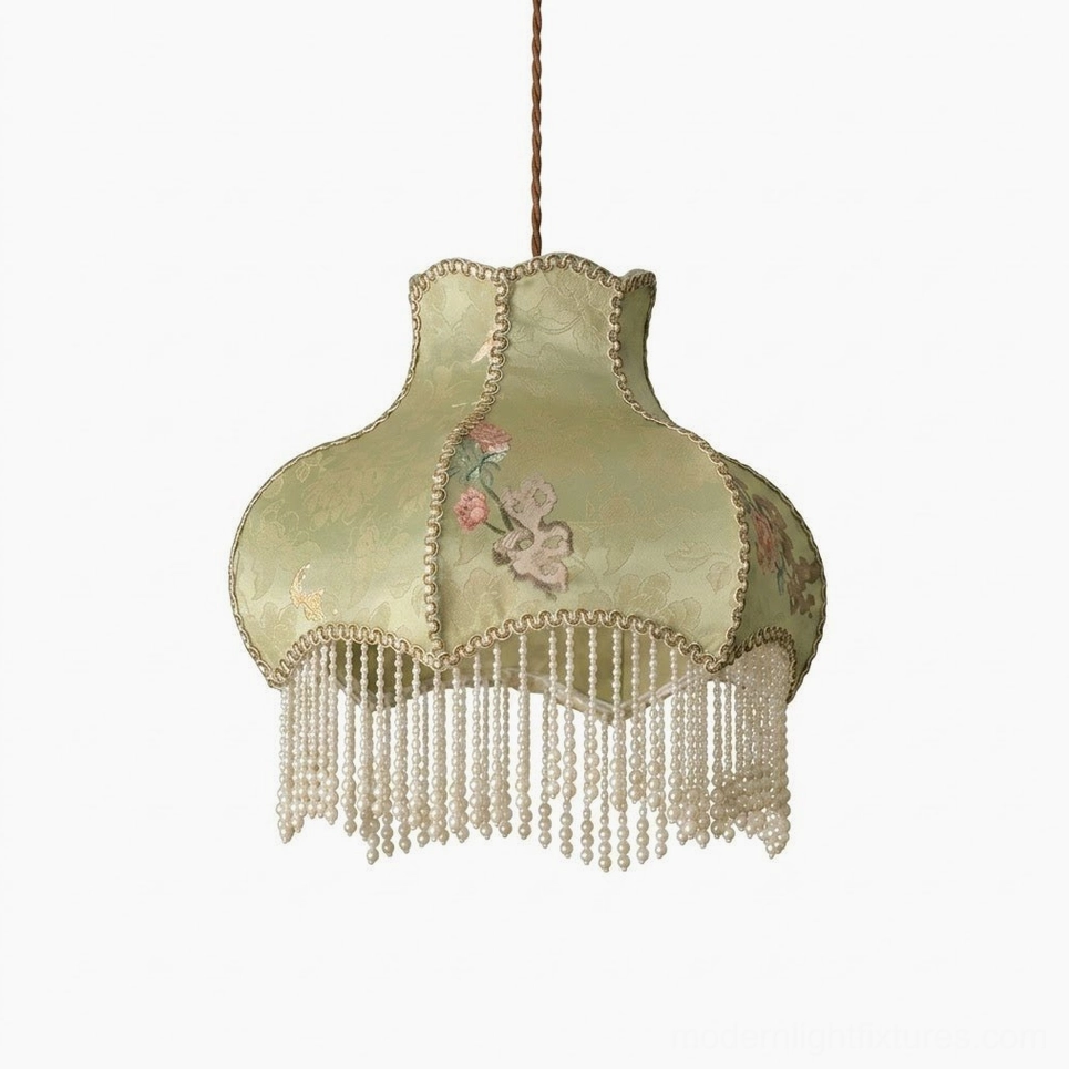 Sage green embroidered damask pendant light with warm LED glow illuminating home interior