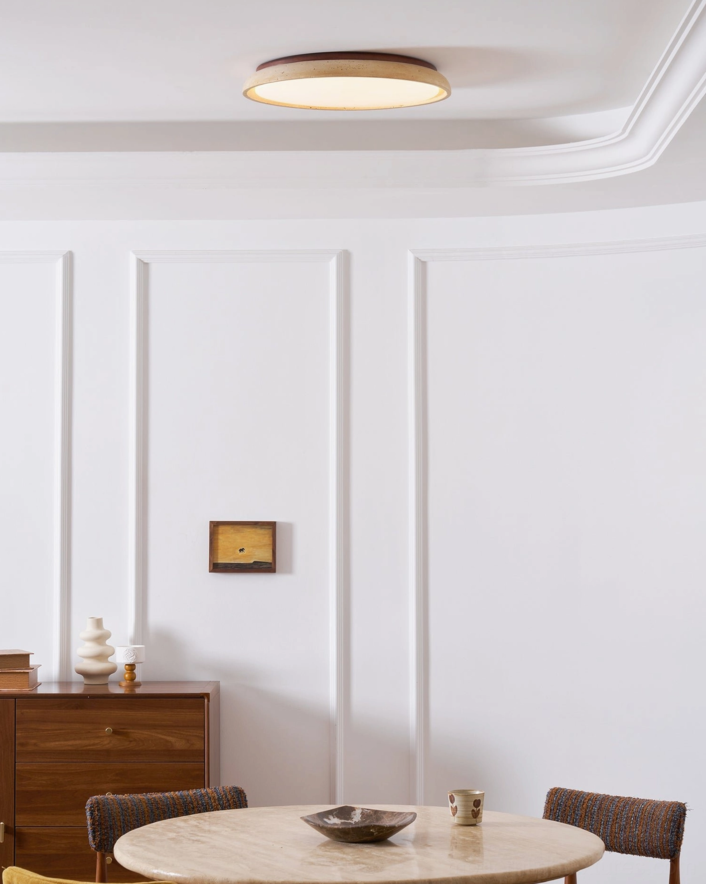 Modern natural stone ceiling light fixture in minimalist bathroom with damp-rated design