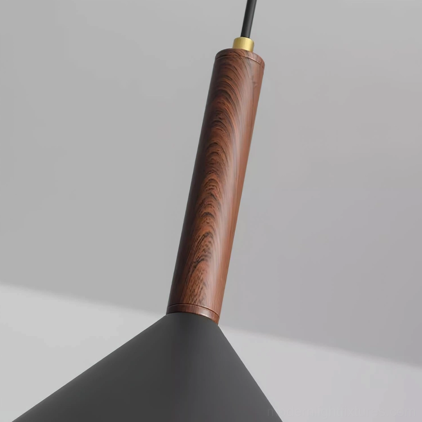 Close-up detail of Dante pendant lamp showing wood grain texture, brass connector and wooden spherical accent
