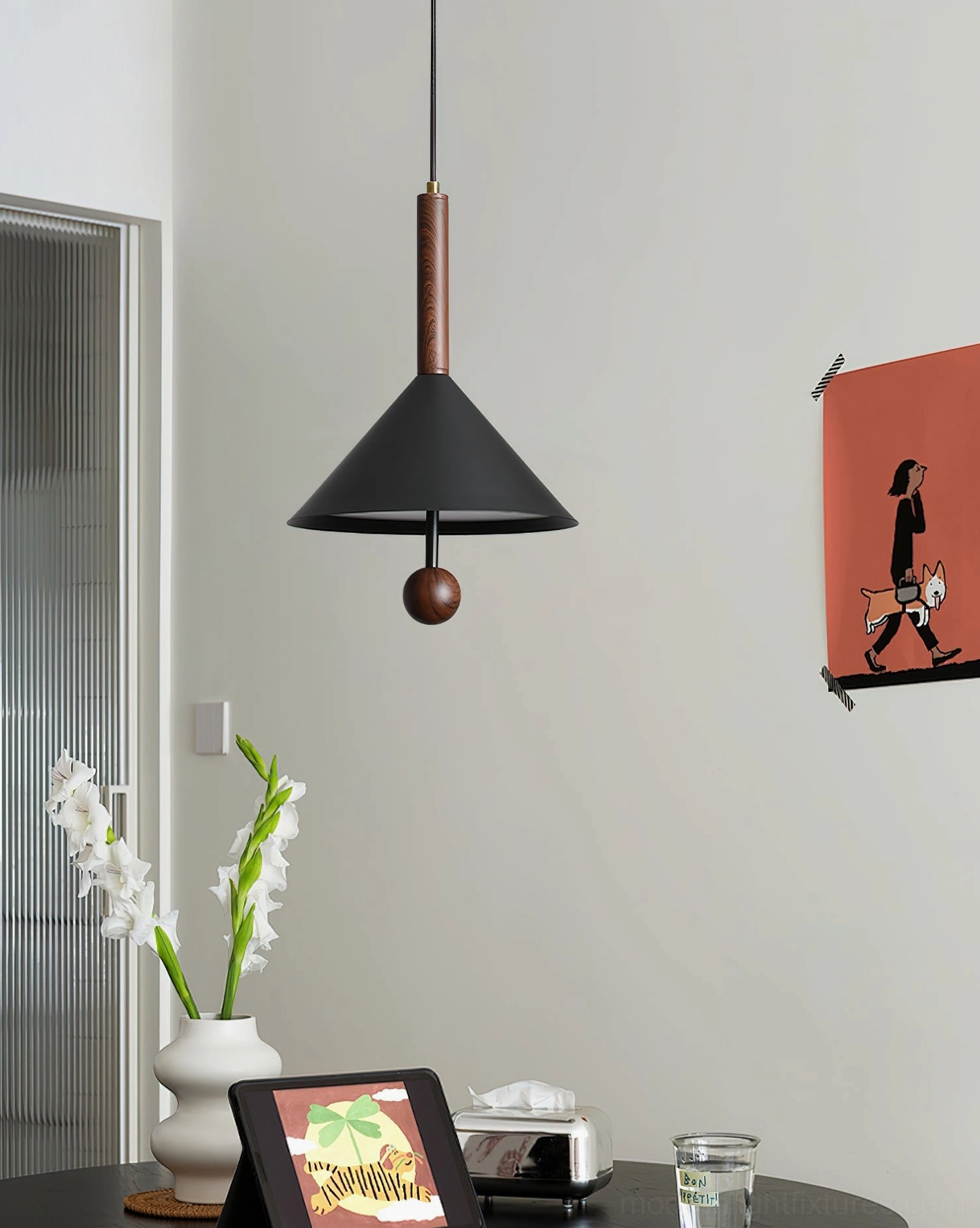 Dante minimalist pendant light in warm dining area with wall art and plant decor near frosted glass door