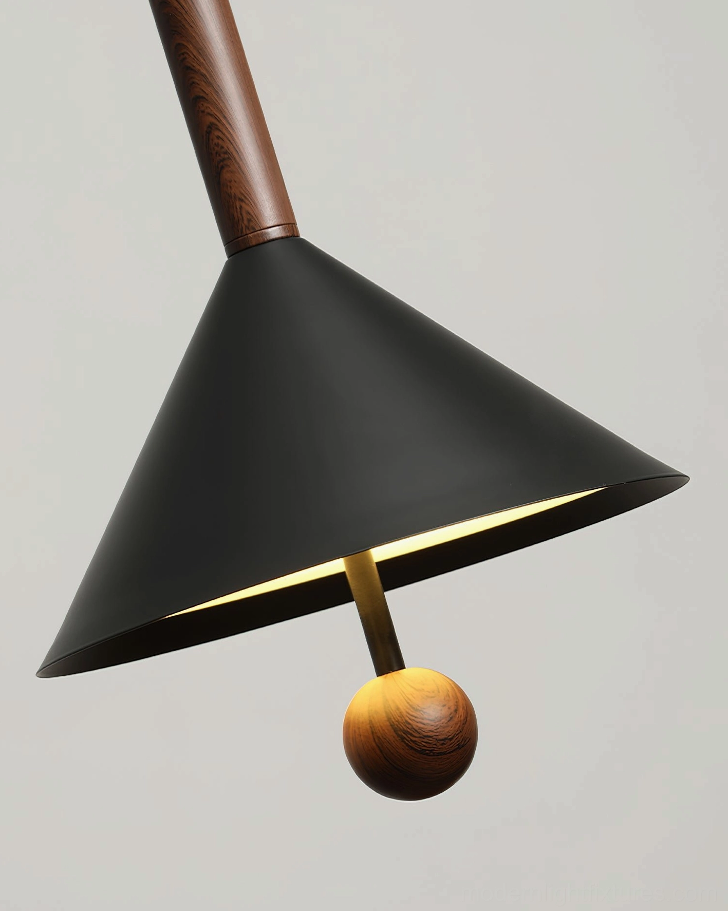 Dante pendant light front view close-up showcasing warm integrated LED glow inside black cone shade and wood detail