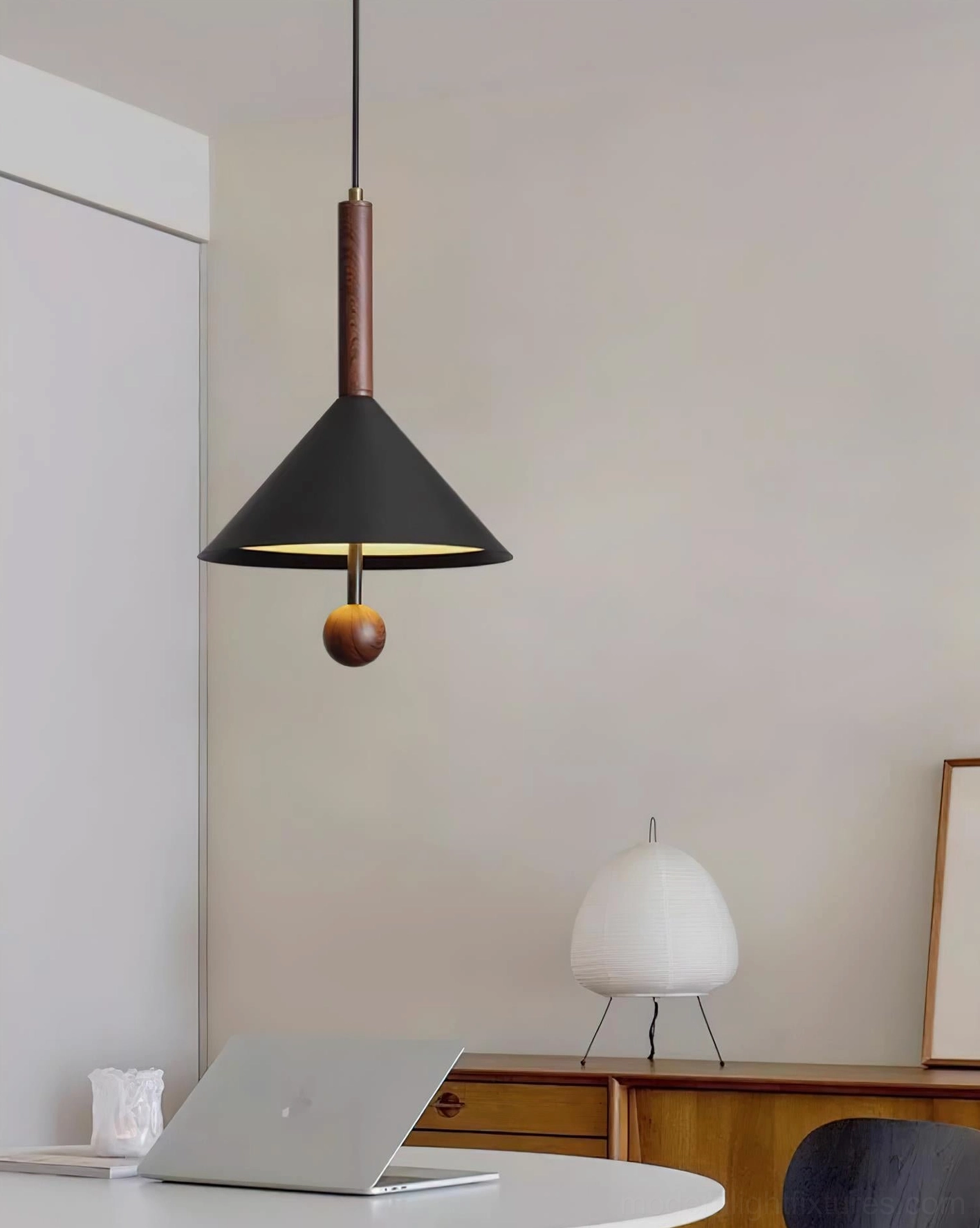 Dante cone pendant lamp illuminating modern home office with round desk and neutral warm minimalist decor