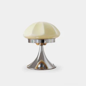 Dario mushroom table lamp with white faceted glass shade and polished chrome base on studio white backdrop