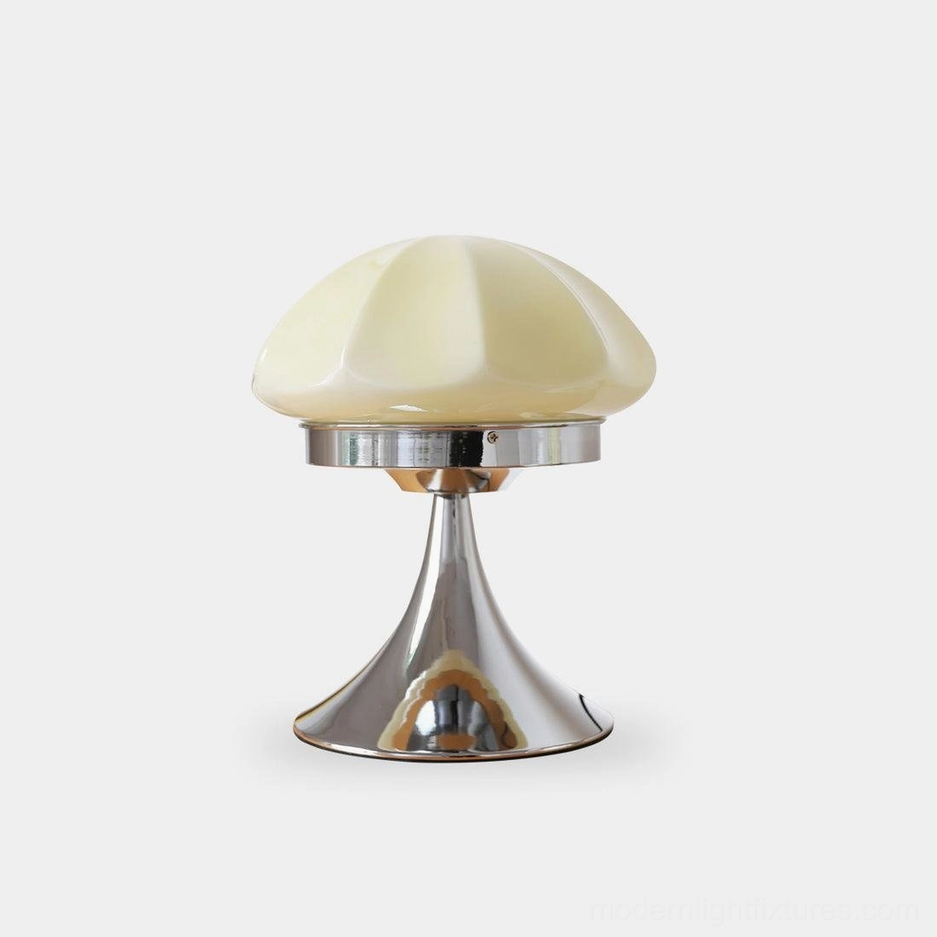 Dario mushroom table lamp with white faceted glass shade and polished chrome base on studio white backdrop