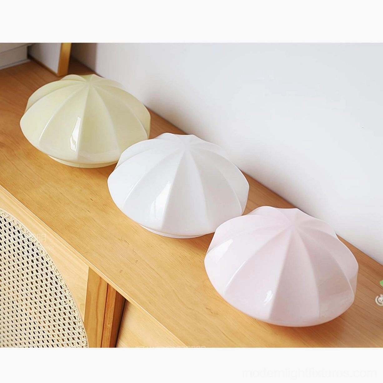 Dario mushroom table lamp with white glass shade illuminated in evening ambient lighting bedroom setting