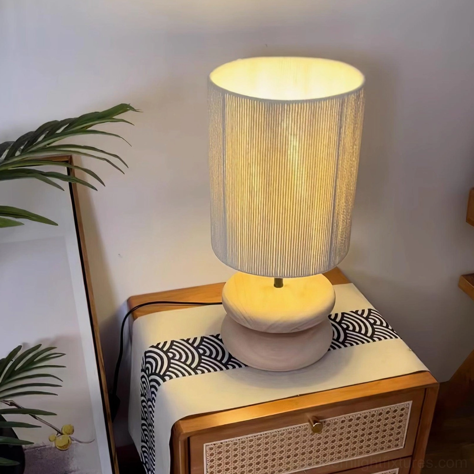 Dark wood hand-turned base lamp with soft fabric shade for bedroom lighting