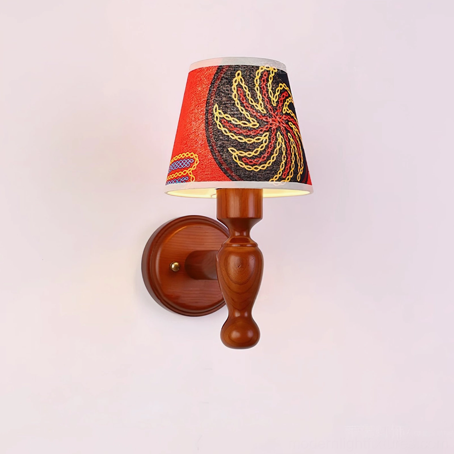 Wooden wall sconce with patterned fabric shade, decorative lighting solution