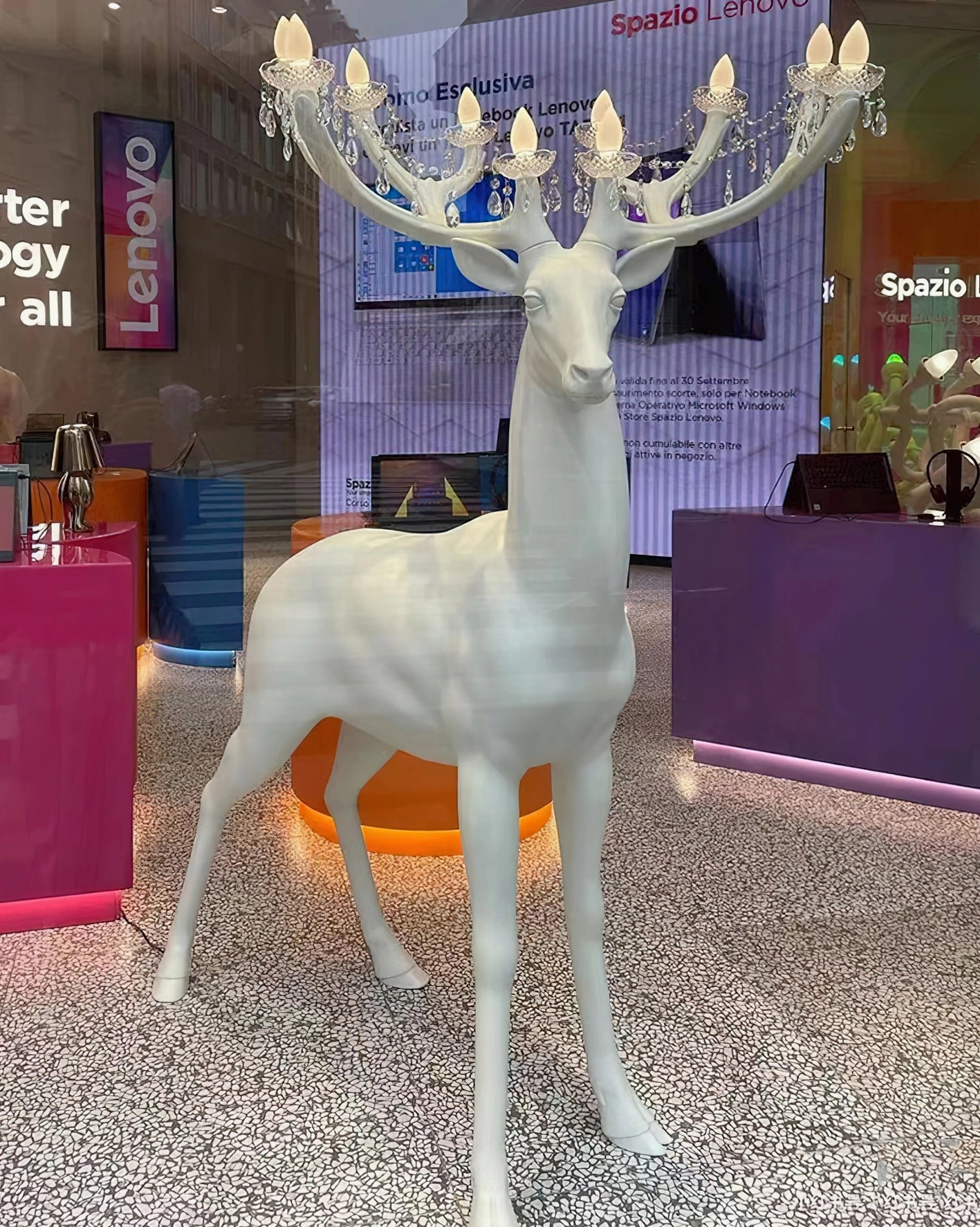 Modern deer sculpture floor lamp with chandelier antlers displayed in tech exhibition hall