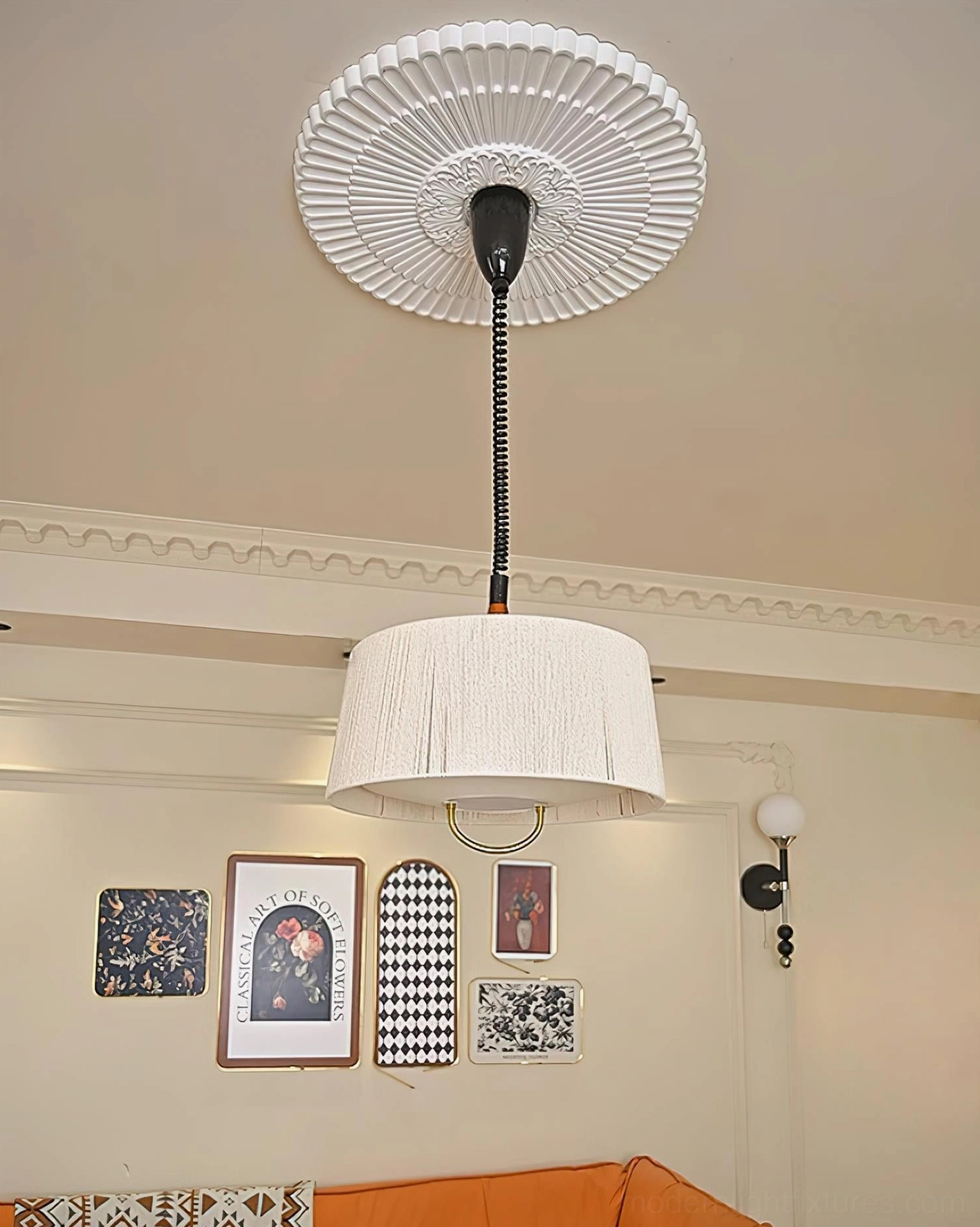Delaney tapered drum pendant light creating warm layered lighting in contemporary home ambiance with industrial-organic fusion style