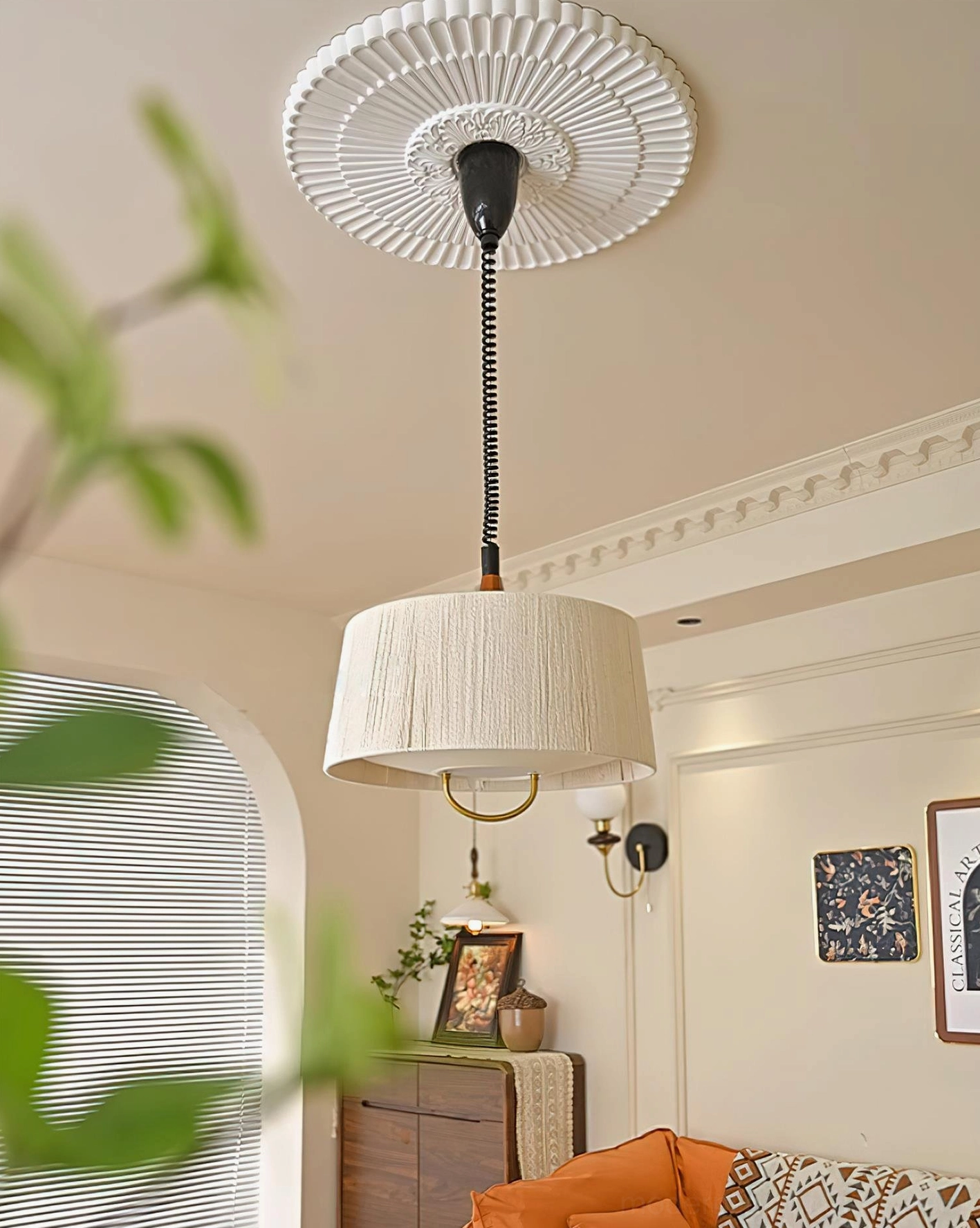 Delaney tapered drum pendant light in Scandinavian minimalist interior setting with natural light and wood accents